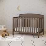 Benton hazelnut crib in a nursery