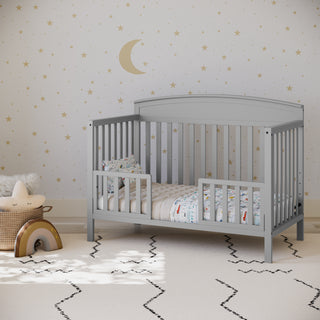 pebble gray crib in toddler bed conversion with 2 toddler safety guardrails, in nursery