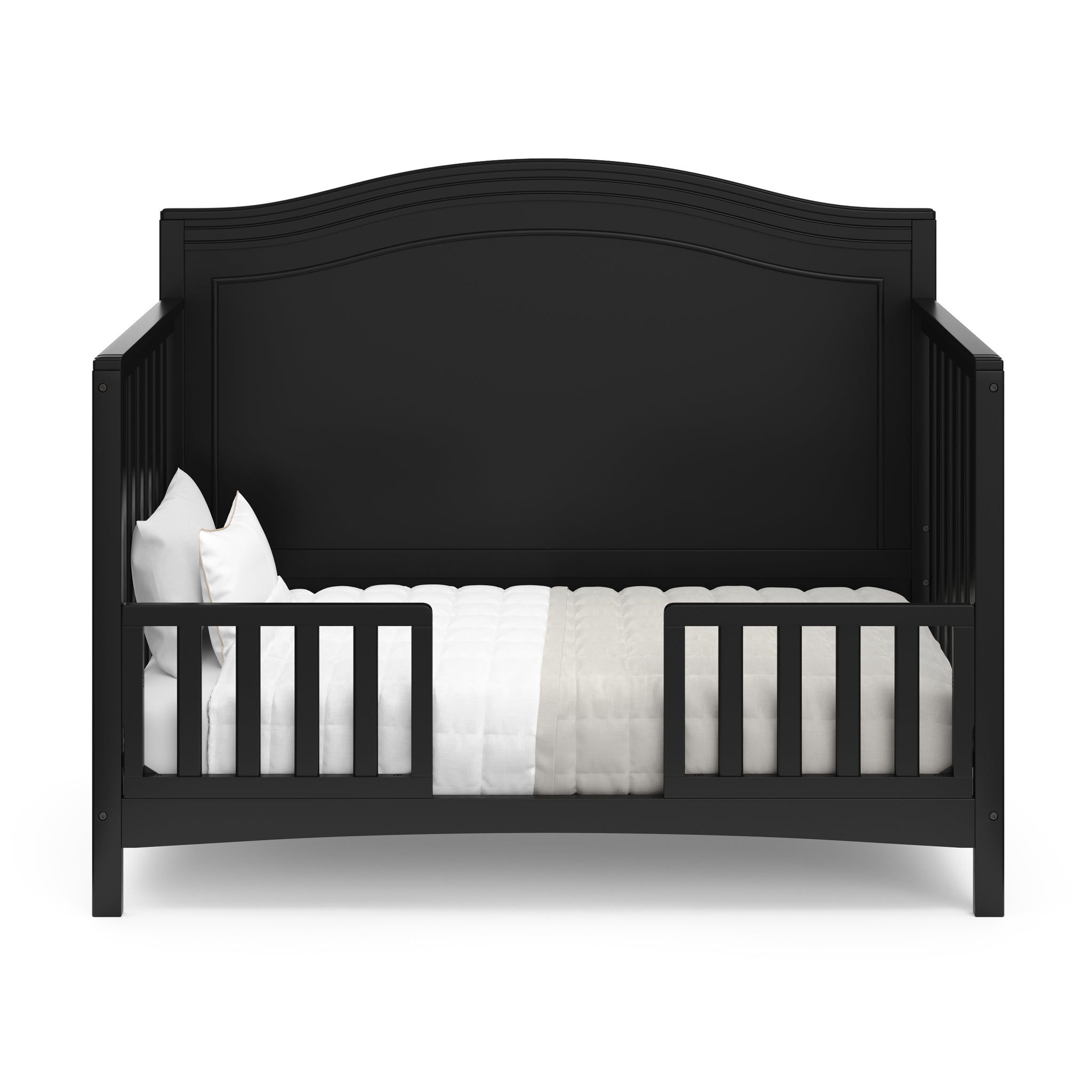 black crib in toddler bed conversion with two guardrails