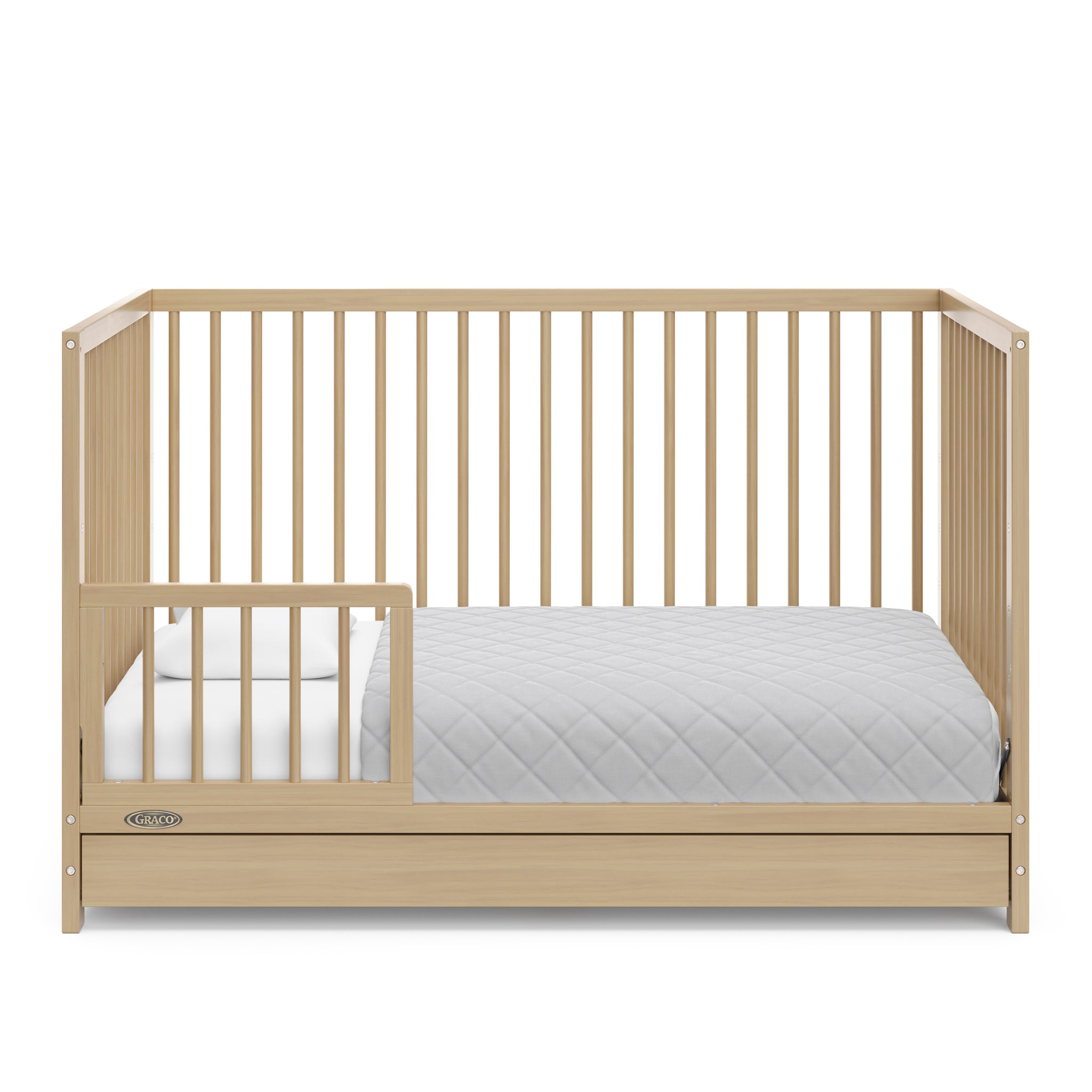 Driftwood crib with drawer in toddler bed conversion with one safety guardrail