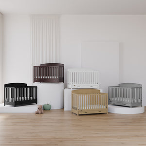 5 cribs with drawer showcased in different colors and different heights
