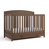 Benton hazelnut crib with drawer angle view