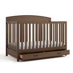 Benton hazelnut crib with drawer open angle view