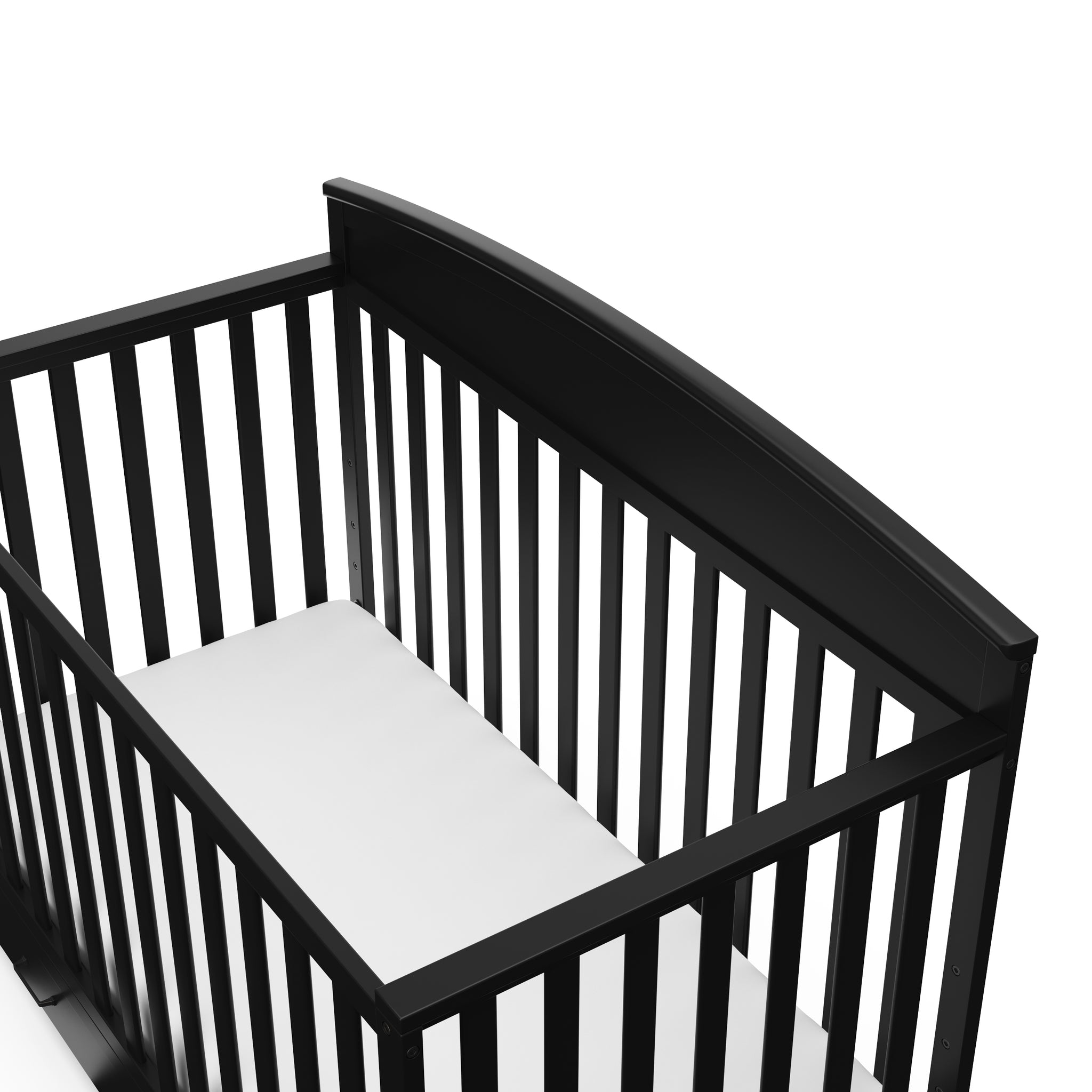 close-up view of black crib with drawer