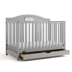Story pebble gray crib with drawer open angle view
