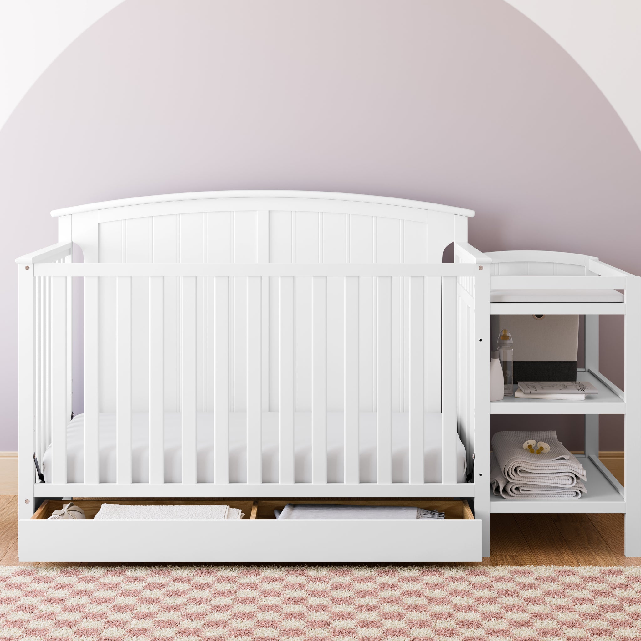 White crib and changer in nursery