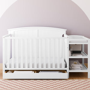 White crib and changer in nursery