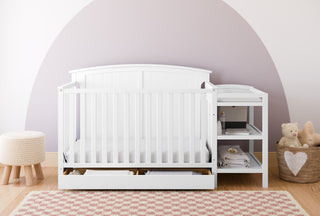White crib and changer in nursery
