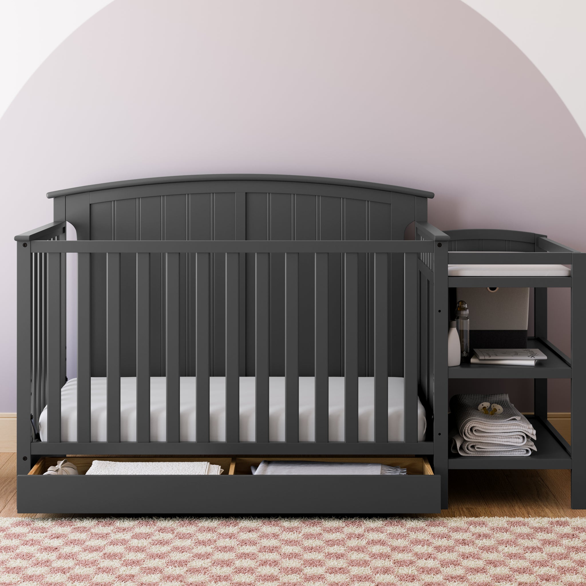 Gray crib and changer in nursery