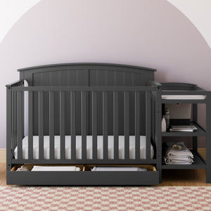 Gray crib and changer in nursery