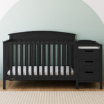 Benton black crib and changer in a nursery