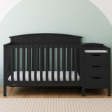 Benton black crib and changer in a nursery