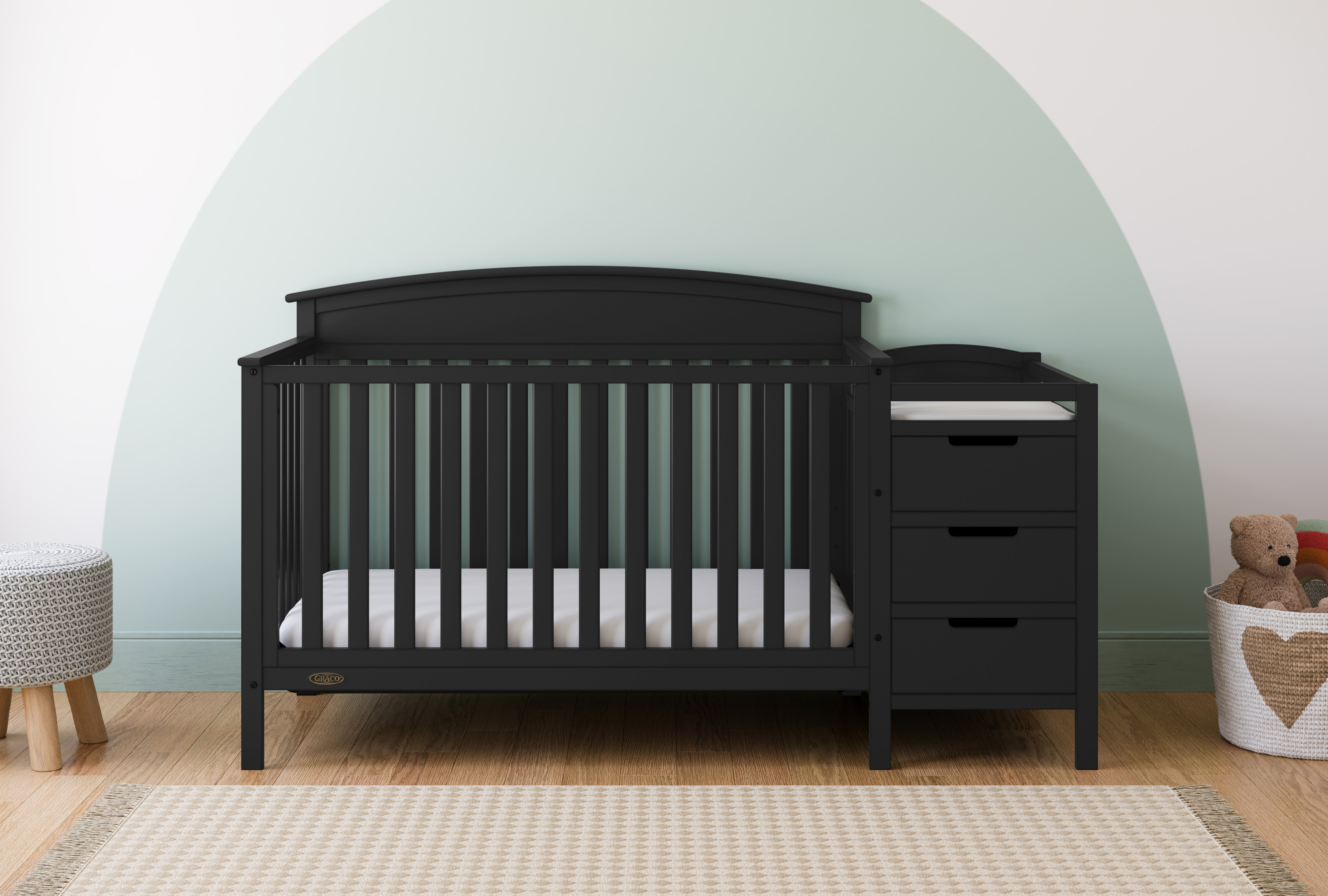 Benton black crib and changer in a nursery