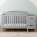 Benton pebble gray crib and changer in a nursery