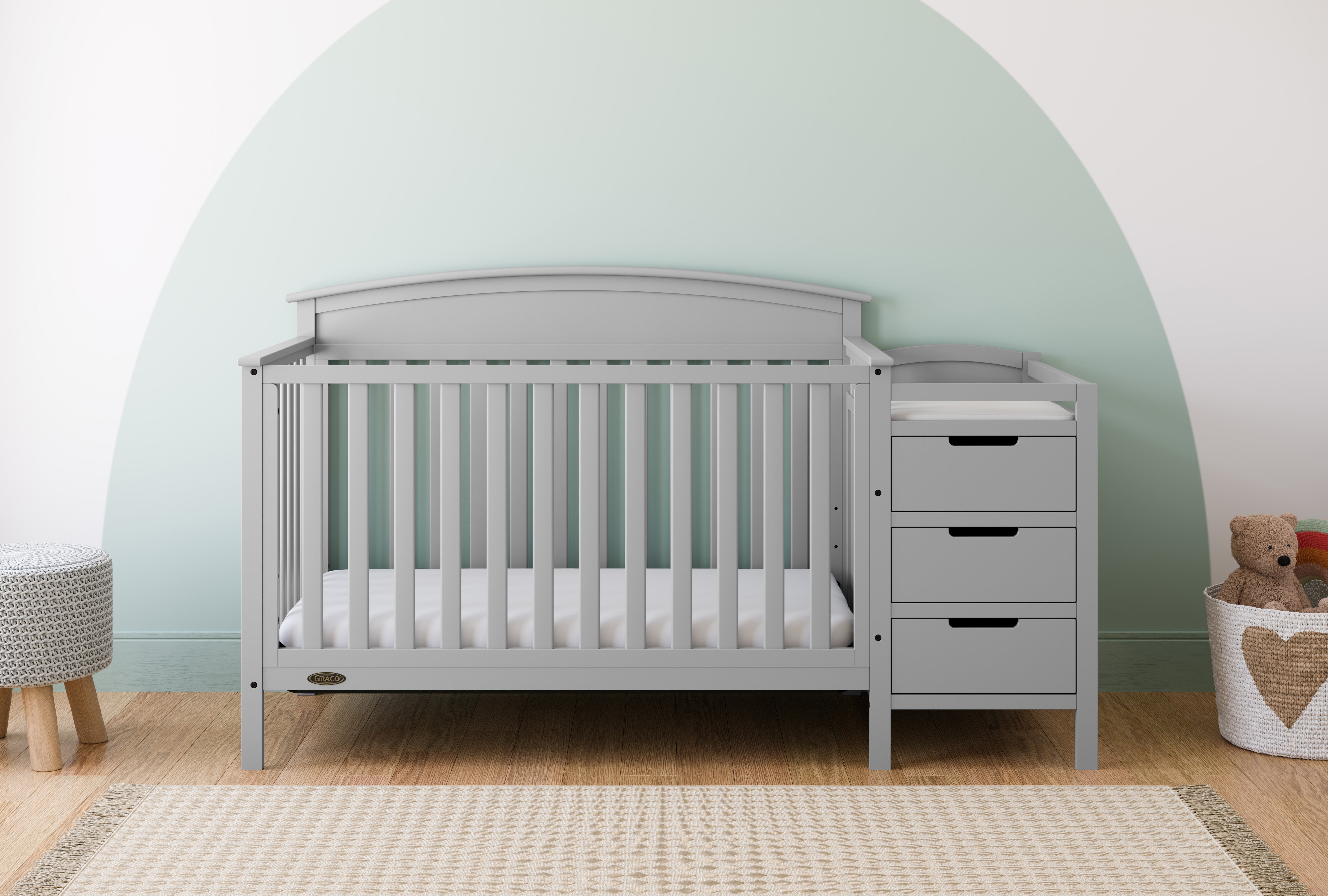 Benton pebble gray crib and changer in a nursery