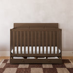 Asheville hazelnut crib with drawer in a nursery