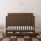 Asheville hazelnut crib with drawer in a nursery