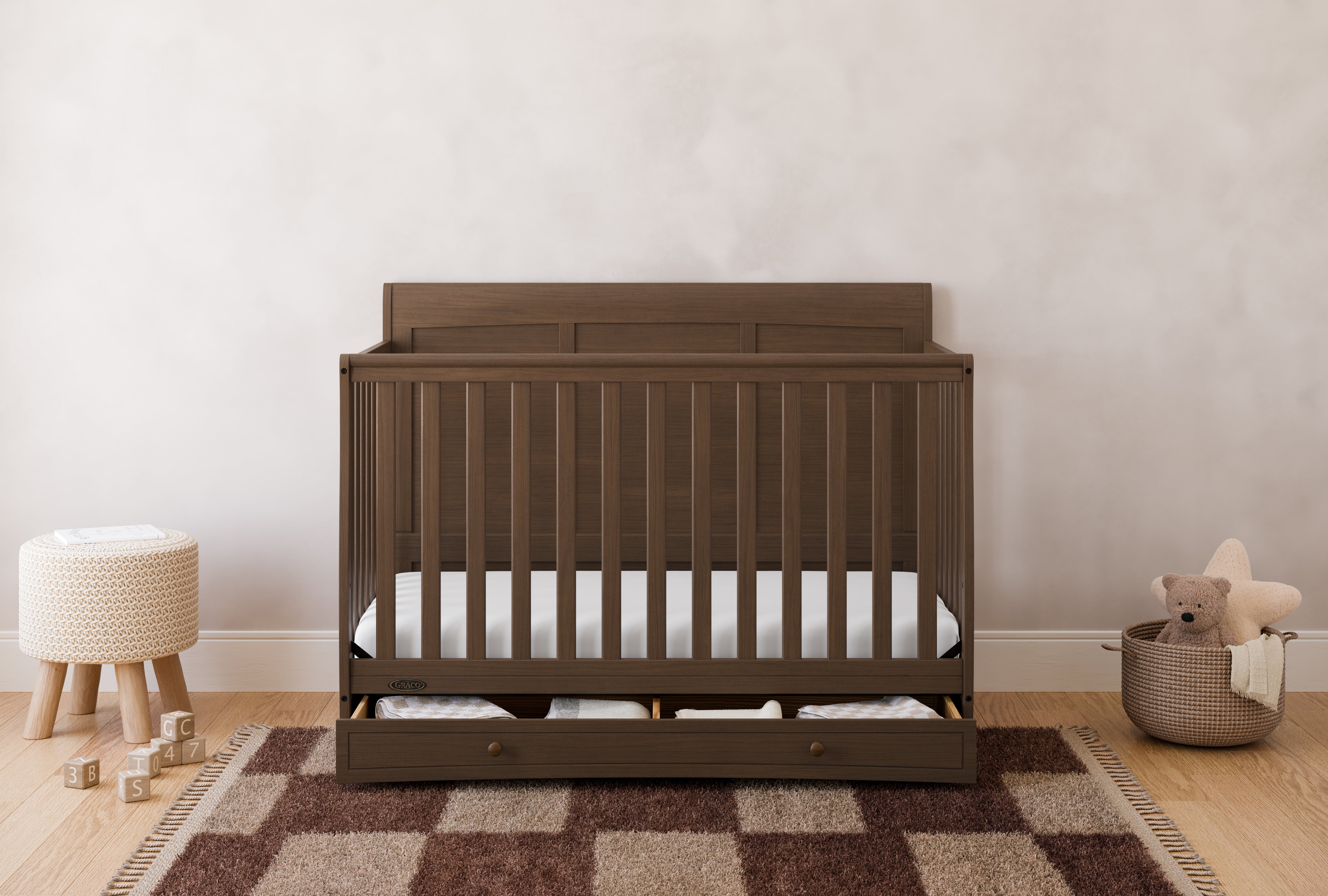 Asheville hazelnut crib with drawer in a nursery