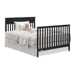 Shiloh black crib and changer with drawers open full-size bed and footboard conversion