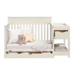 Shiloh frosted oat crib and changer with drawers open daybed conversion