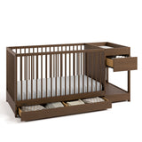 Teddi hazelnut crib and changer angle view with baby items in drawers