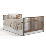 Teddi hazelnut crib and changer converted to full-size bed with footboard