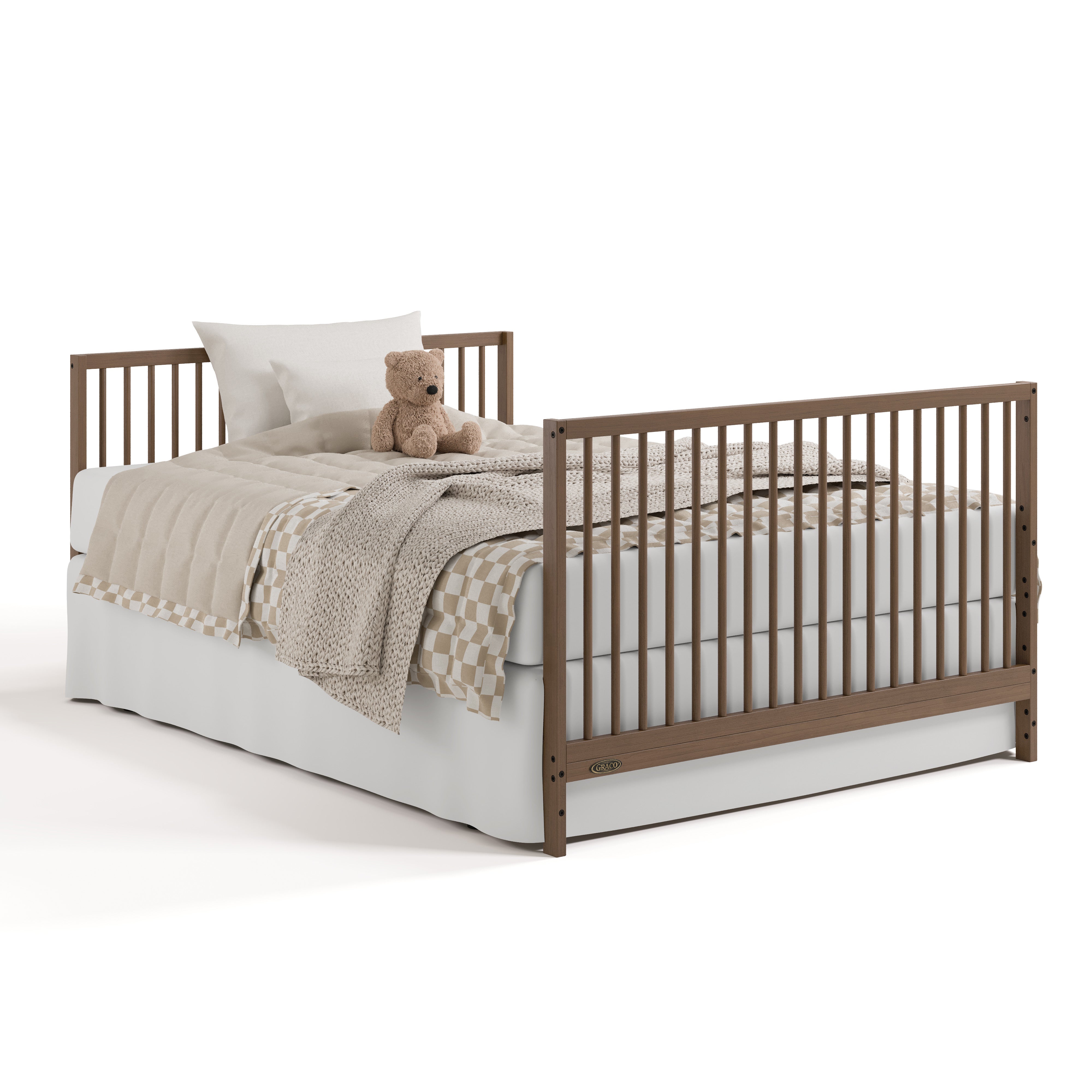 Teddi hazelnut crib and changer converted to full-size bed with footboard