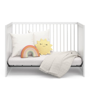 white crib in day bed conversion