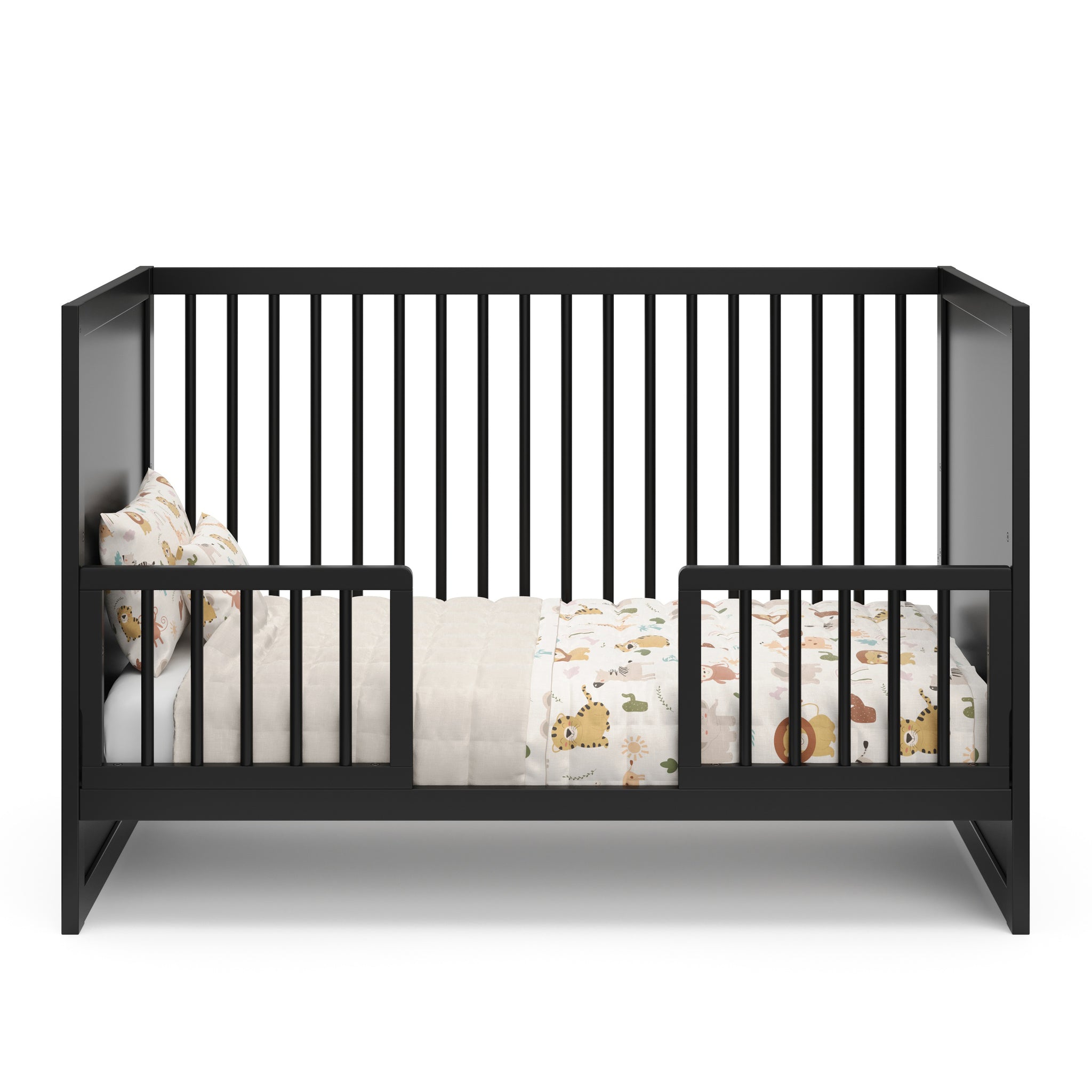 black crib in toddler bed conversion with 2 guardrails