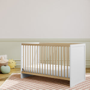 white with driftwood crib in nursery