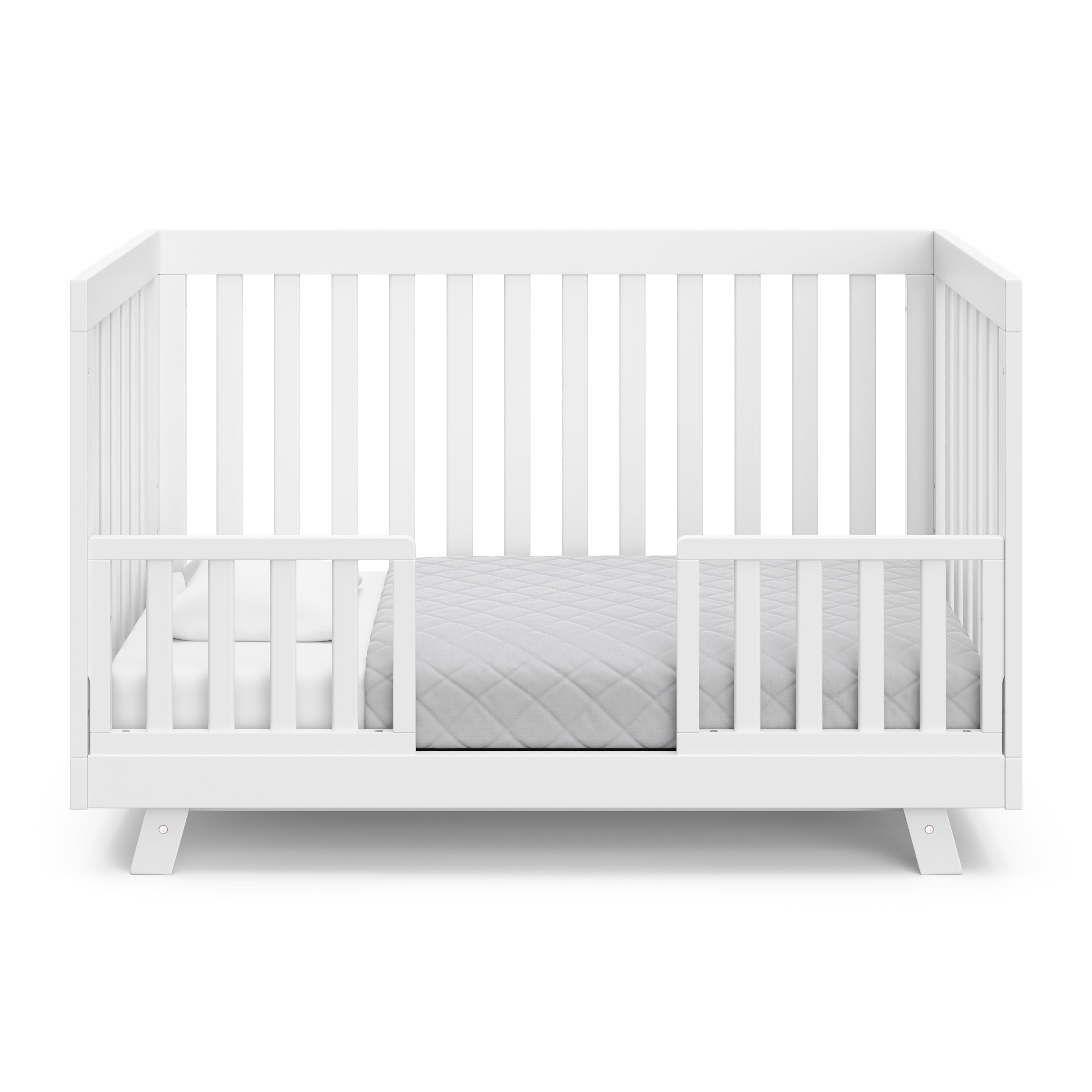 Beckett white crib converted to toddler bed with two guardrails