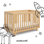Beckett natural crib with black doodles overlaid on image
