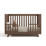 Beckett hazelnut crib converted to toddler bed with two guardrails