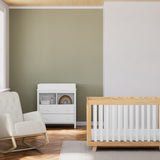 Beckett natural with white crib in nursery next to rocker and changing dresser