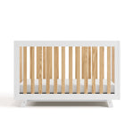 Front view of Beckett crib in white with natural 