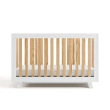 Front view of Beckett crib in white with natural 