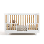 Beckett crib in white with natural converted to toddler bed with two guardrails