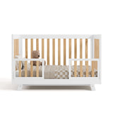 Beckett crib in white with natural converted to toddler bed with two guardrails