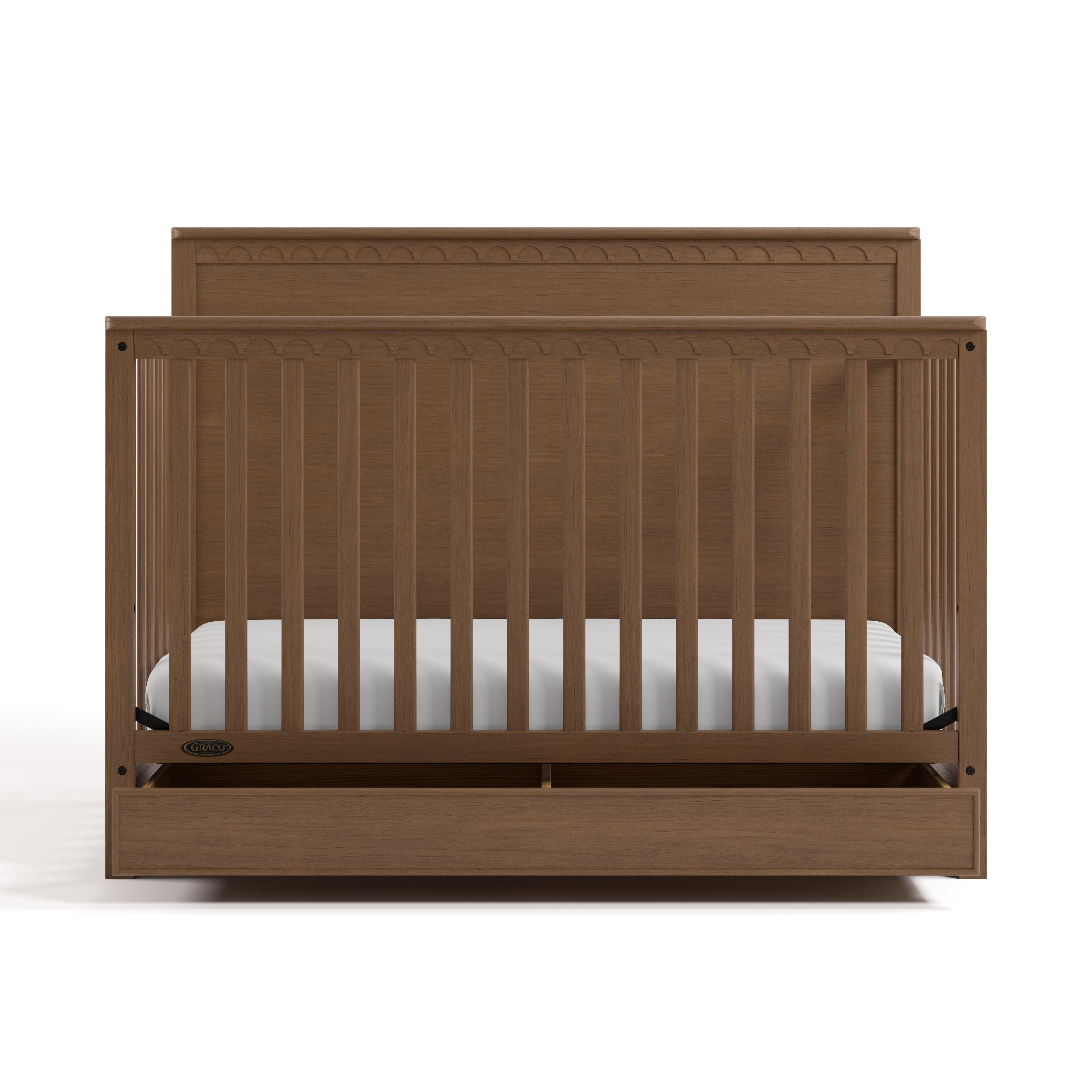 Sasha hazelnut crib with drawer open front view