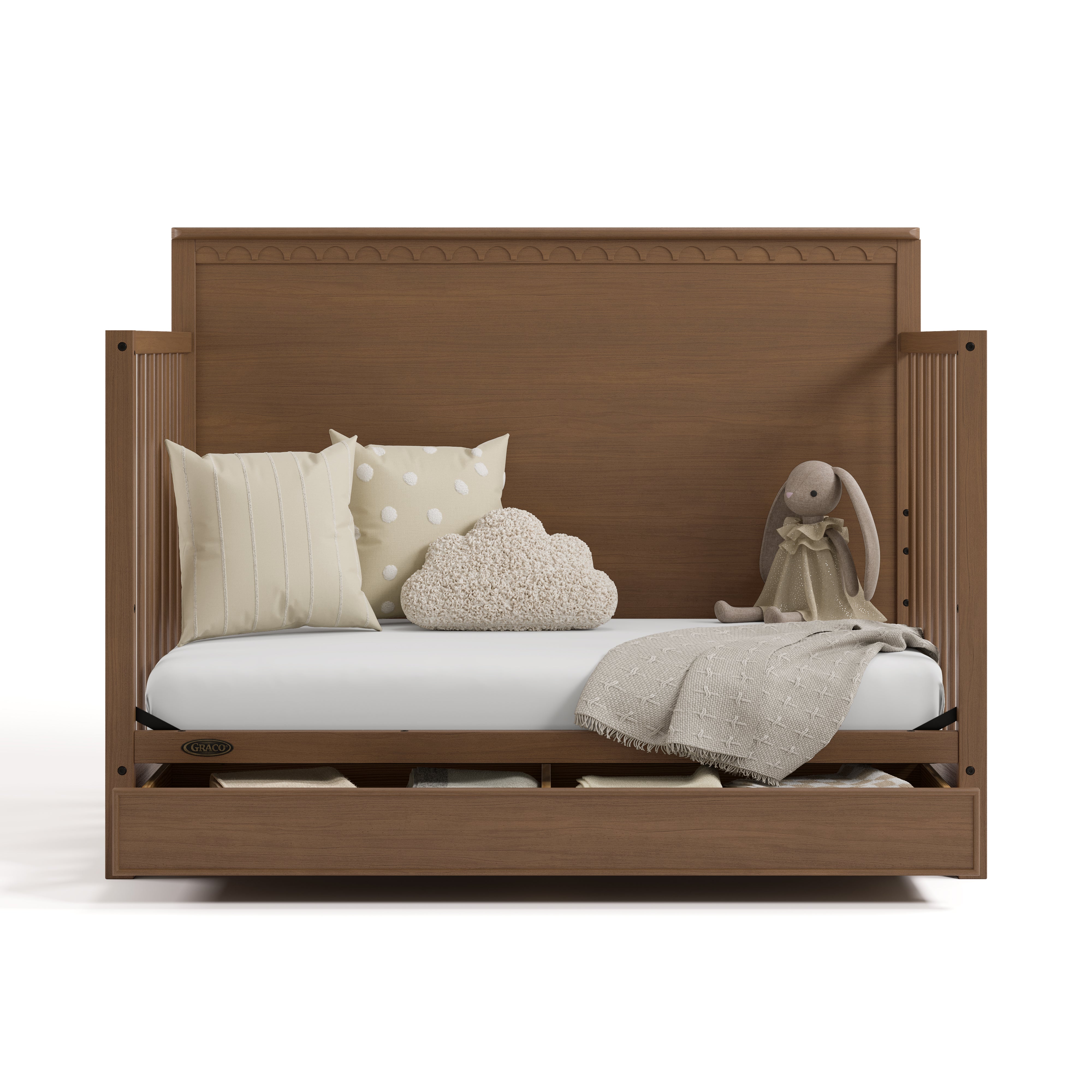 Sasha hazelnut crib with drawer open converted to daybed