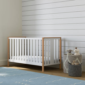 white and vintage driftwood crib in nursery