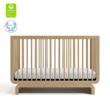 Santorini driftwood crib with GGG and PTPA logos on top left