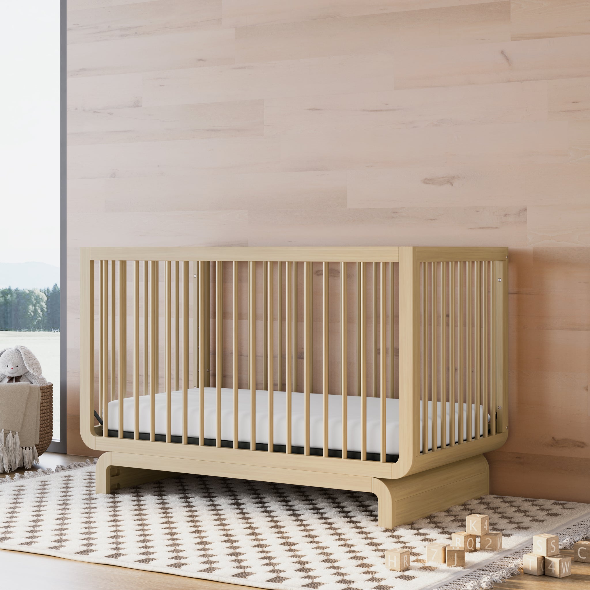 Convertible crib in driftwood colorway in a nursery
