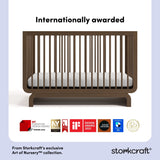 santorini hazelnut crib with award logos on bottom
