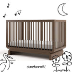 Santorini hazelnut crib with black cartoon drawings