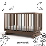 Santorini hazelnut crib with black cartoon drawings