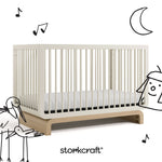 Santorini frosted oat with driftwood crib with black cartoon drawings