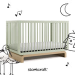 Santorini sage with driftwood crib with black cartoon drawings