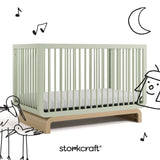 Santorini sage with driftwood crib with black cartoon drawings
