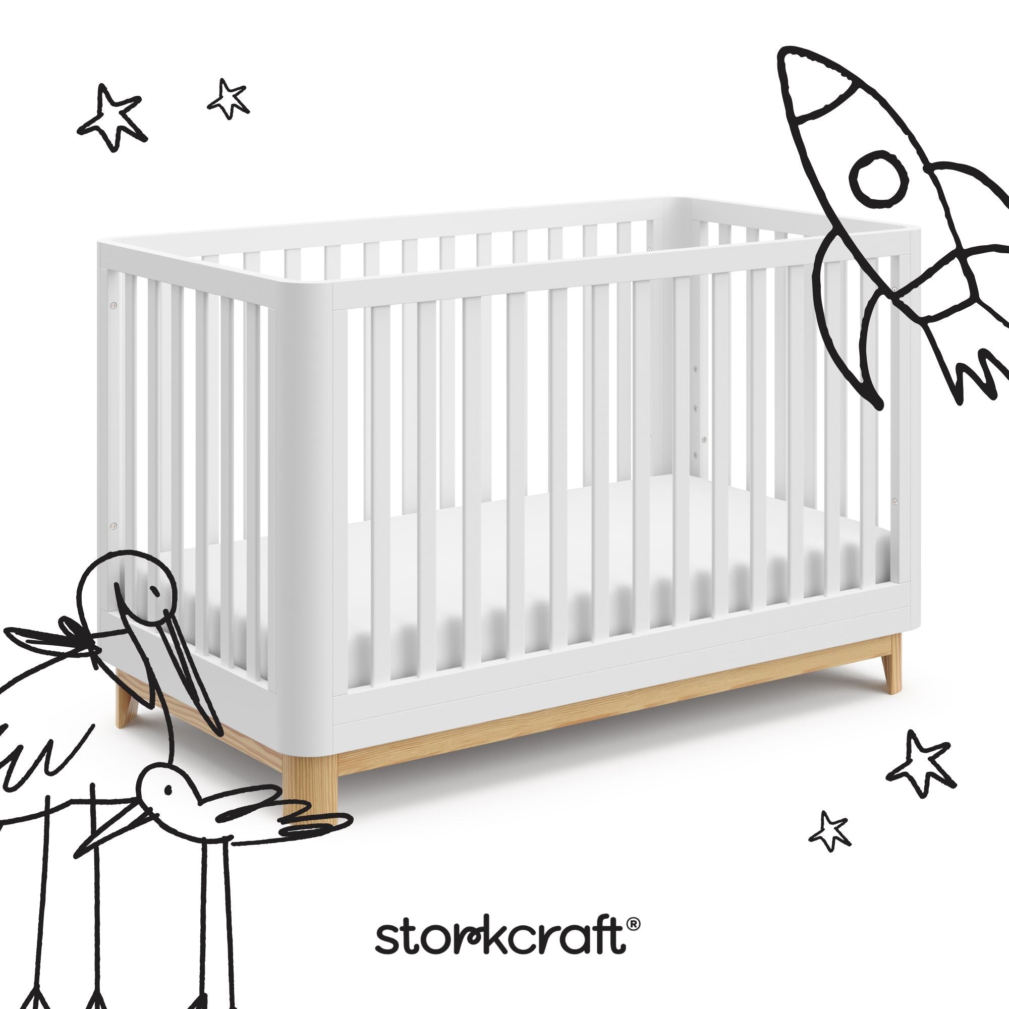 santos white with natural crib with black cartoon drawings